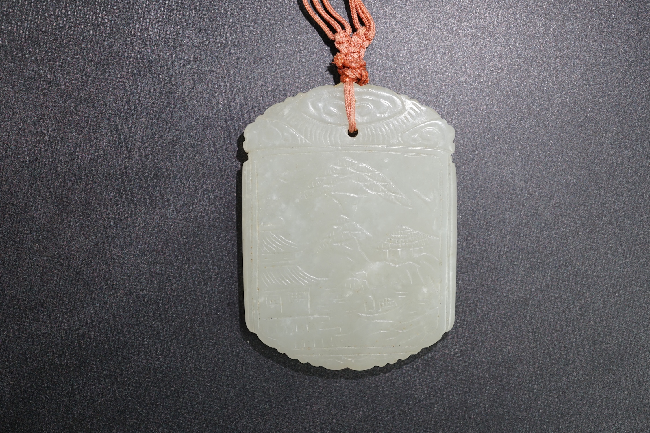 An unusual Chinese pale celadon jade plaque, 19th century